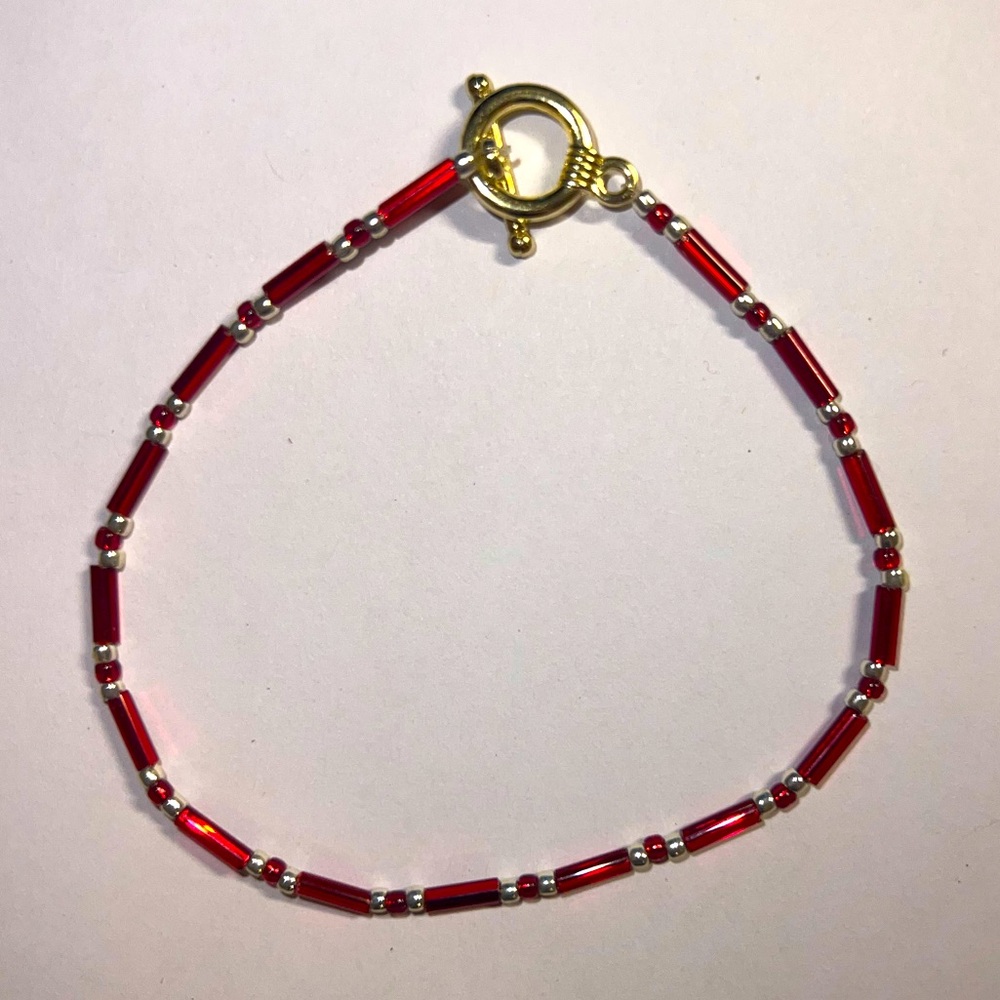 Tennis red&gold bead bracelet.